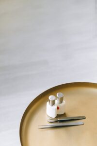white plastic bottle on brown round plate